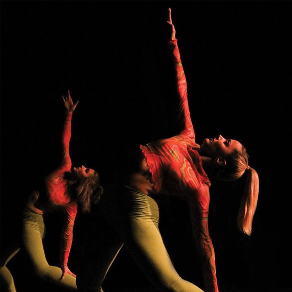 Two dancing students performing side by side